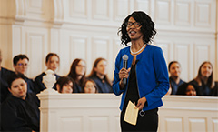 female speaker in front of congregation